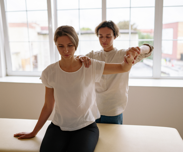 Physiotherapist restoring shoulder mobility and joint flexibility