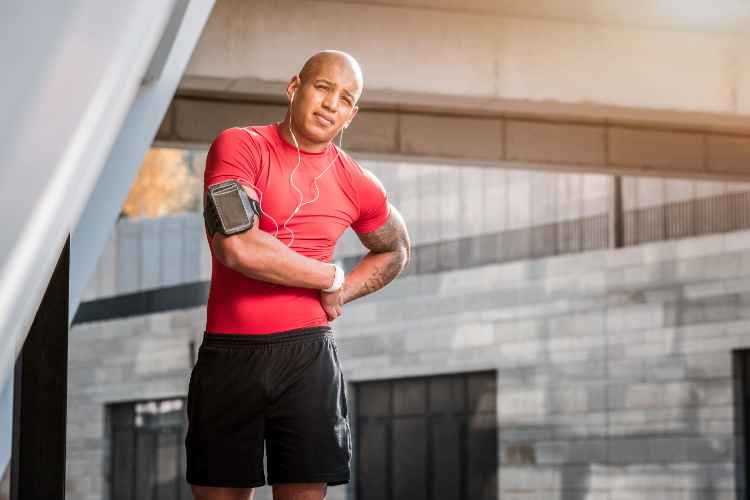 Active Adult Runner Experiencing Hip Pain Outdoors
